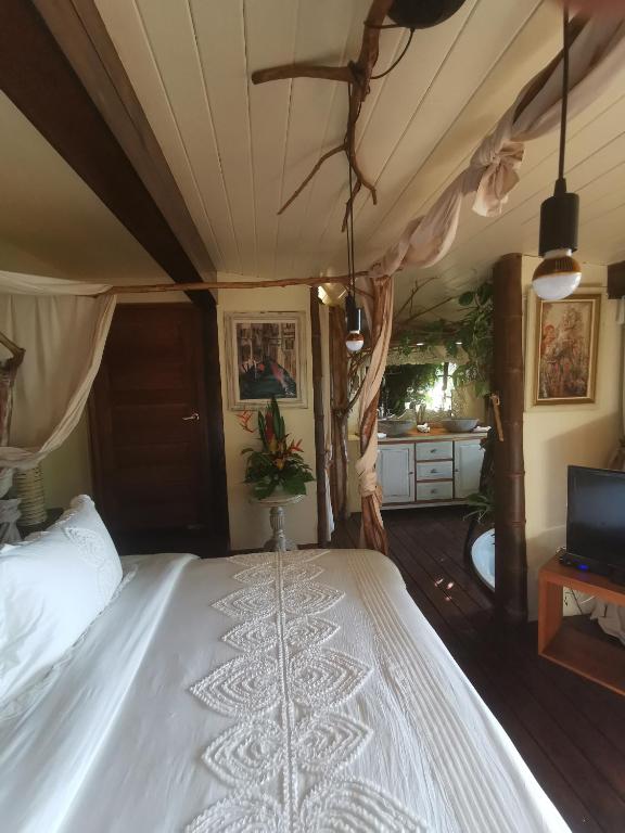Postel nebo postele na pokoji v ubytování Hôtel Fenua Mata'i'oa