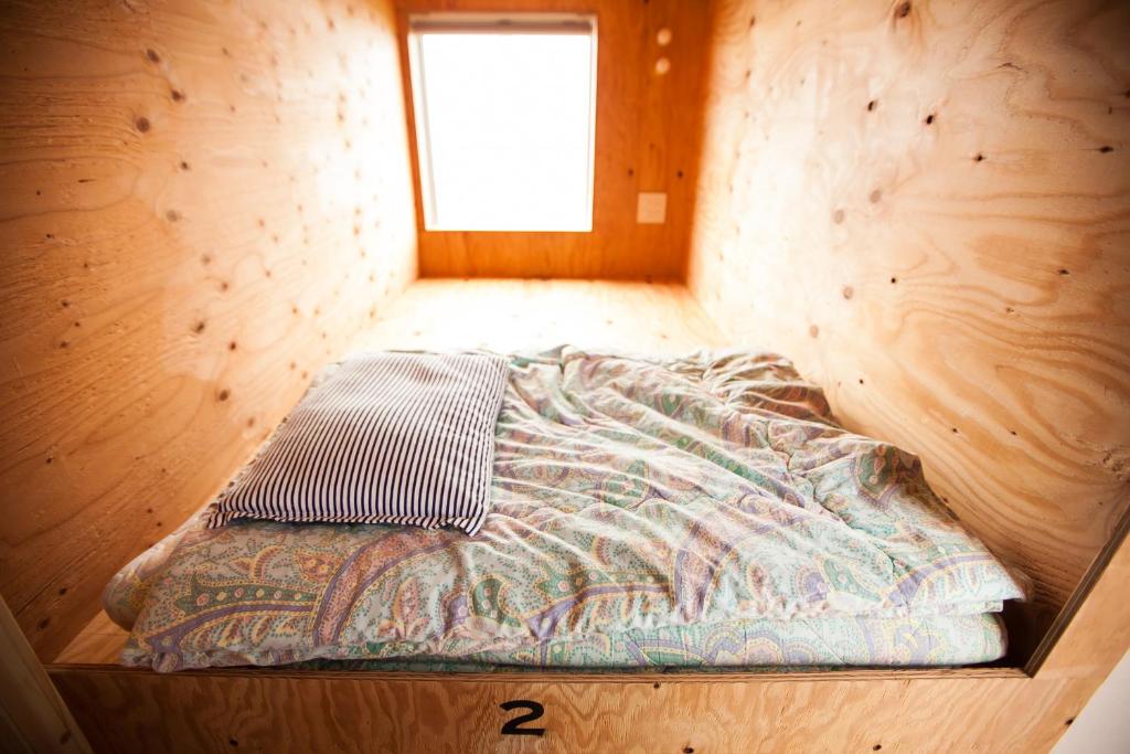 Postel nebo postele na pokoji v ubytování Sunset Breeze Hota