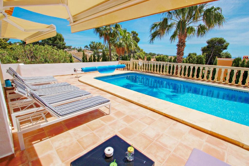 The swimming pool at or close to Michelle - sea view villa with private pool in Benissa