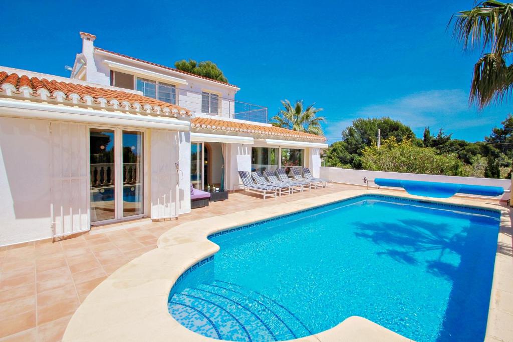 The swimming pool at or close to Michelle - sea view villa with private pool in Benissa