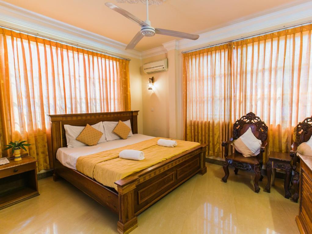 Postel nebo postele na pokoji v ubytování Asia Hotel
