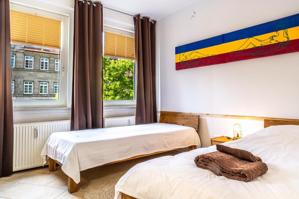 Postel nebo postele na pokoji v ubytování Am Spittlerturm