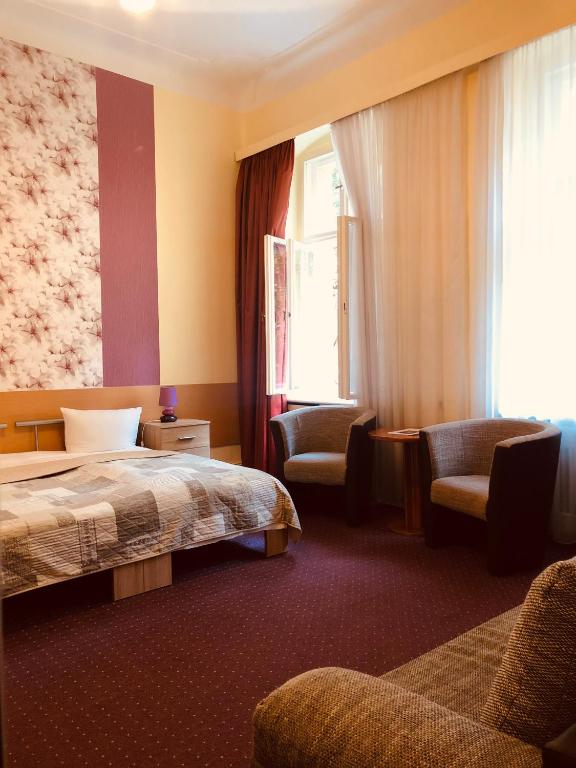 Postel nebo postele na pokoji v ubytování Hotel Castell am Kurfürstendamm