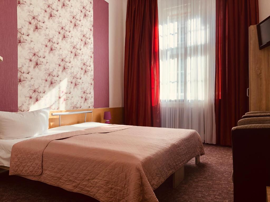 Postel nebo postele na pokoji v ubytování Hotel Castell am Kurfürstendamm
