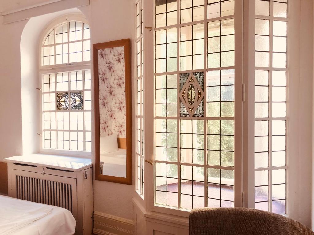 Postel nebo postele na pokoji v ubytování Hotel Castell am Kurfürstendamm
