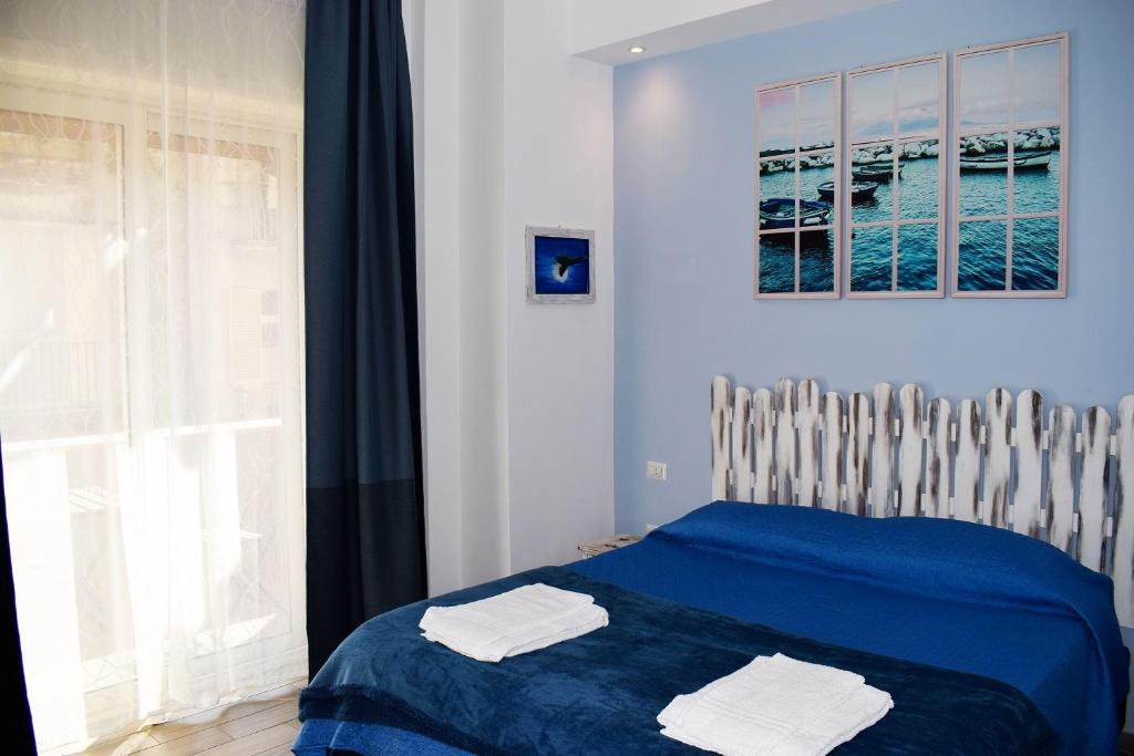 Postel nebo postele na pokoji v ubytování Neapolis Pie