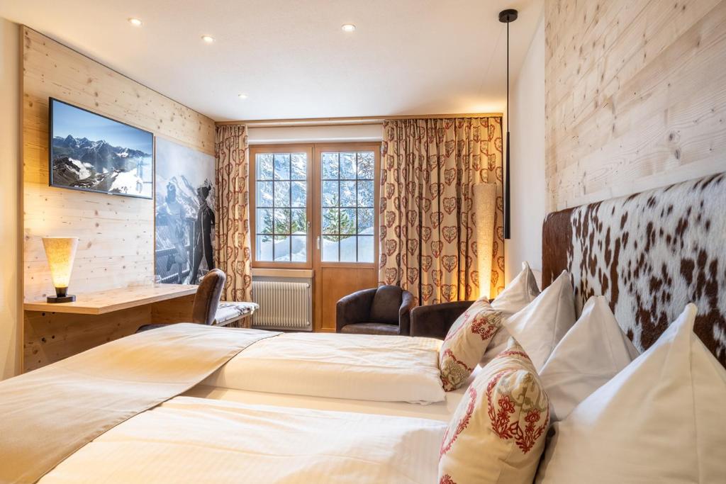 Postel nebo postele na pokoji v ubytování Hotel Alpenruh