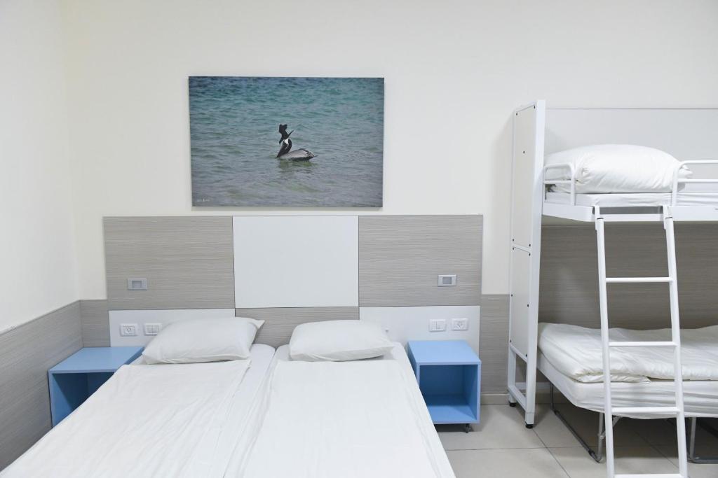 Postel nebo postele na pokoji v ubytování HI - Karei Deshe Hostel