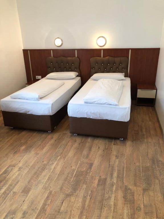 Postel nebo postele na pokoji v ubytování Hotel Verdi