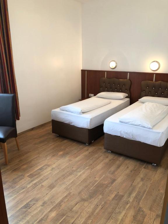 Postel nebo postele na pokoji v ubytování Hotel Verdi
