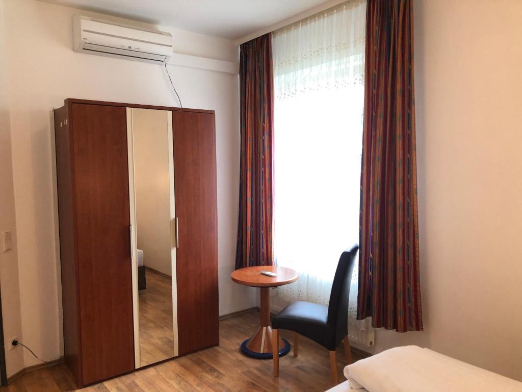 Postel nebo postele na pokoji v ubytování Hotel Verdi