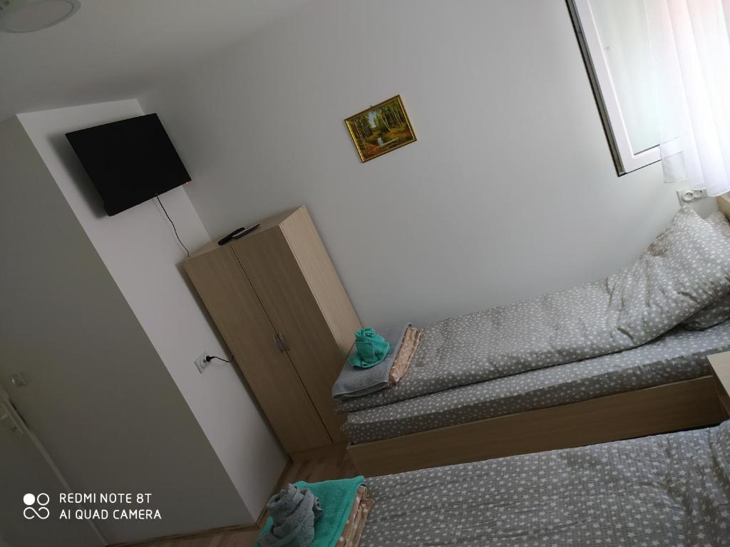 Postel nebo postele na pokoji v ubytování Guest House Vila Banjica