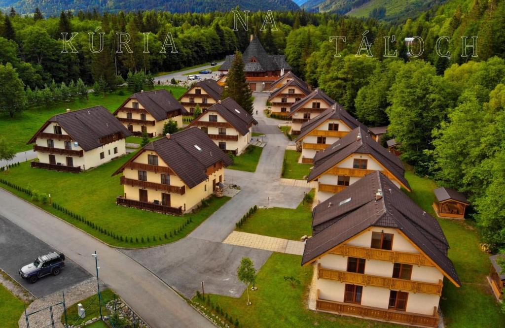 an aerial view of a village with houses and a street at Penzión & apartmány Kúria na Táľoch, Tále - Chopok JUH in Tale