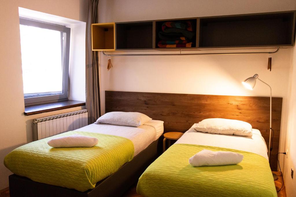 Postel nebo postele na pokoji v ubytování Hostel Museum