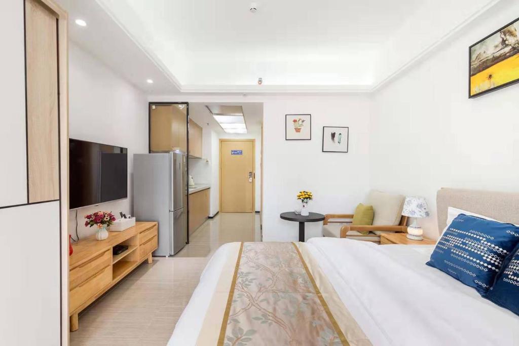 Postel nebo postele na pokoji v ubytování Foshan Laide Apartment