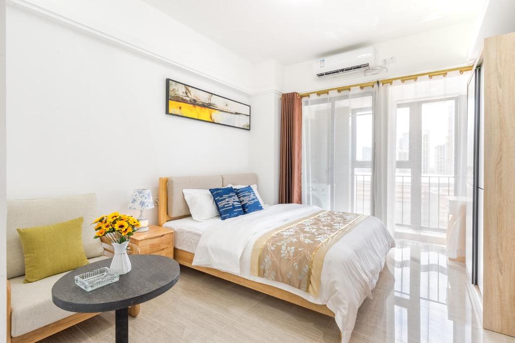 Postel nebo postele na pokoji v ubytování Foshan Laide Apartment
