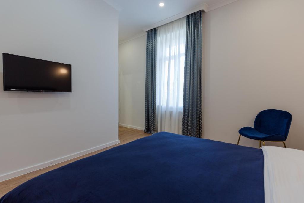 TV a/nebo společenská místnost v ubytování Hotel Lifetime