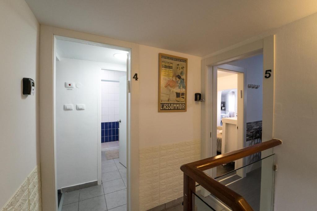 a hallway with a door leading to a bathroom at Eilot in Eilat