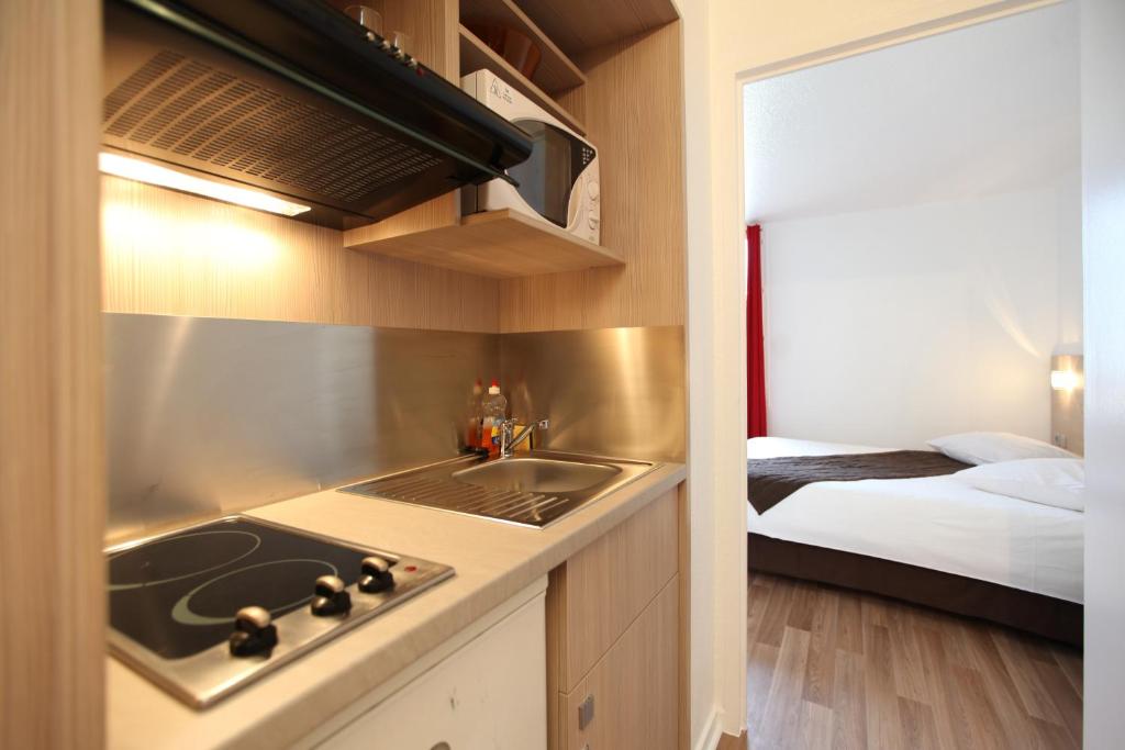 Postel nebo postele na pokoji v ubytování Geneva Residence