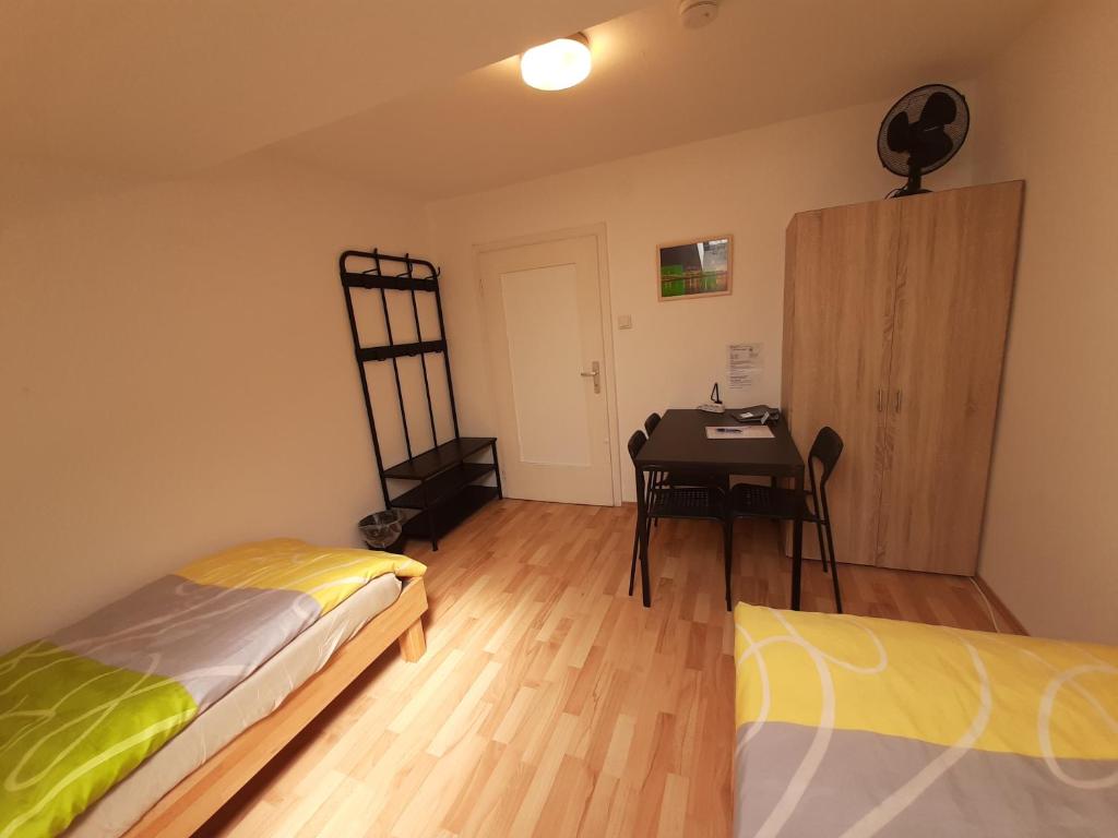 Posteľ alebo postele v izbe v ubytovaní Apartments CITY Stadion