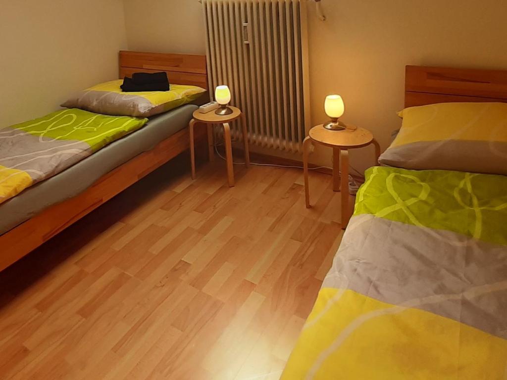 Posteľ alebo postele v izbe v ubytovaní Apartments CITY Stadion