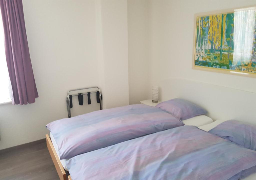 Postel nebo postele na pokoji v ubytování Hotel Le Rivage