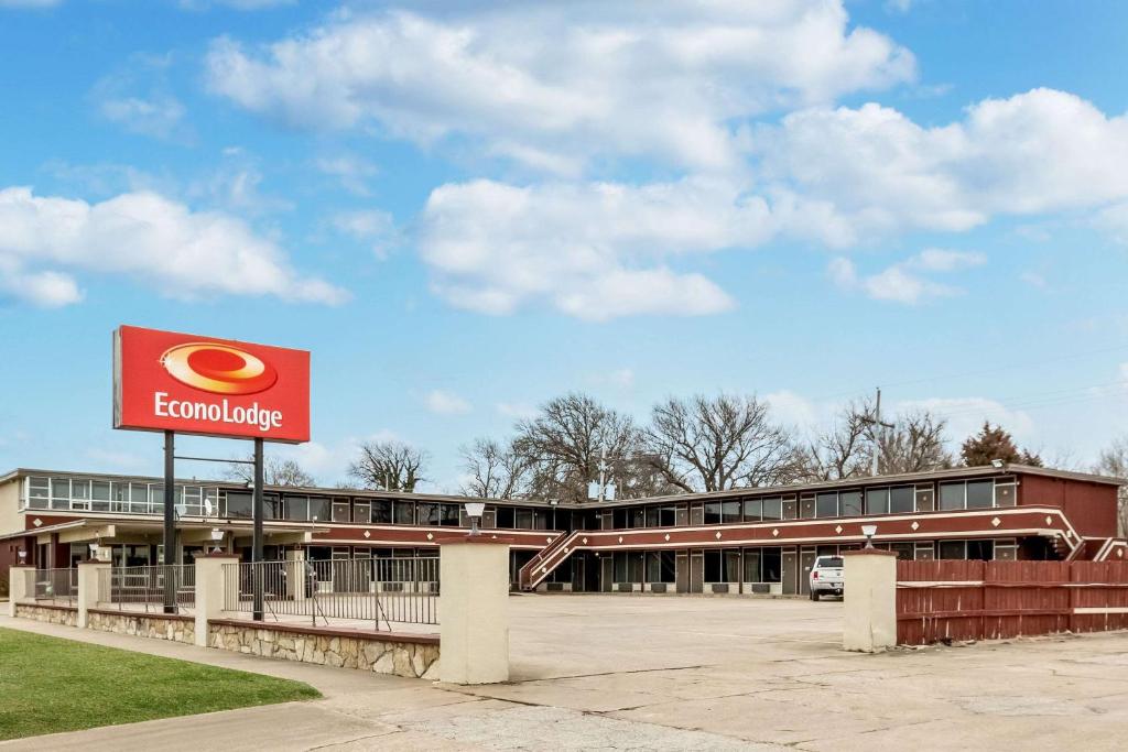 a building with a hamburger sign in front of it at Econo Lodge in Winfield