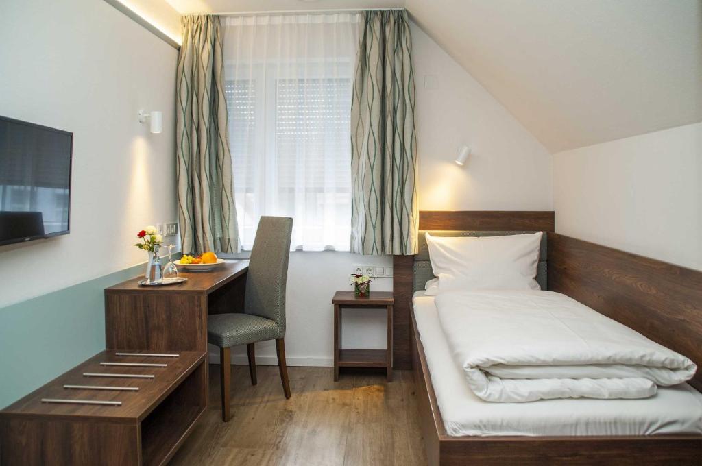 Katil atau katil-katil dalam bilik di Hotel-Gasthof Krone