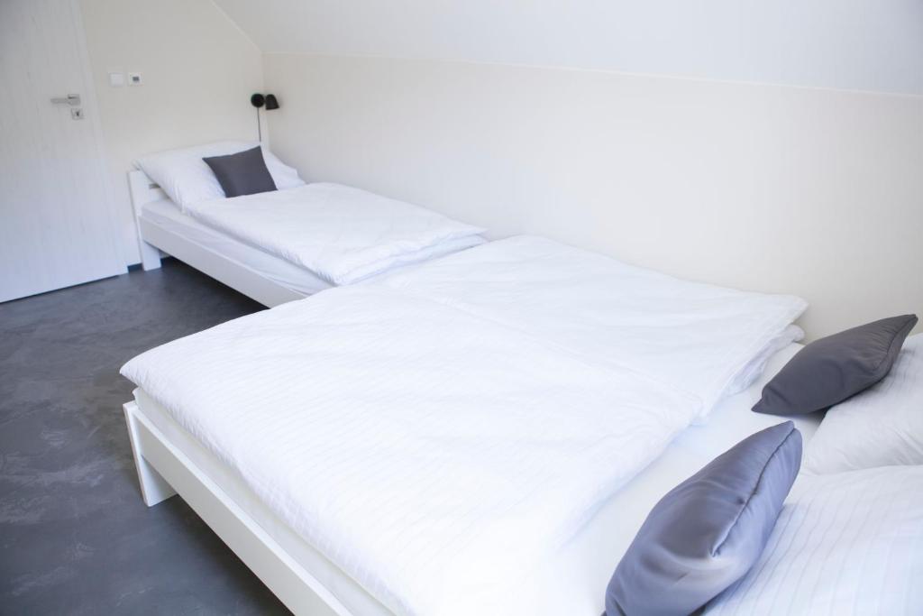 Postel nebo postele na pokoji v ubytování Apartmány U tří bratrů