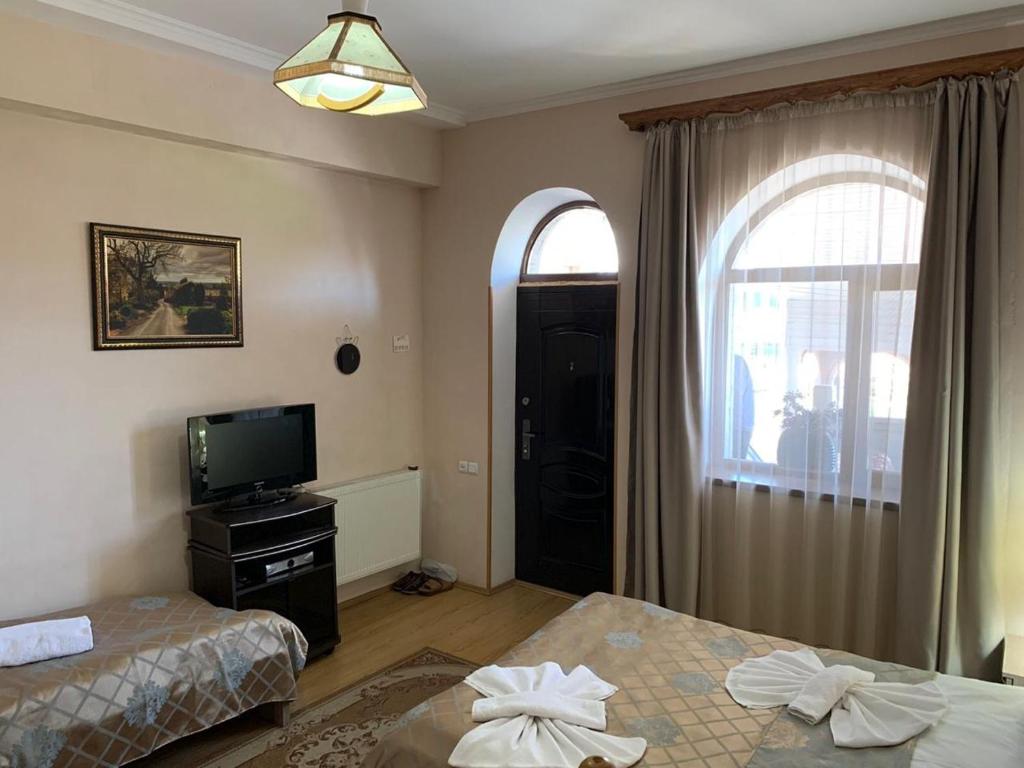 Postel nebo postele na pokoji v ubytování Old Town Akhaltsikhe
