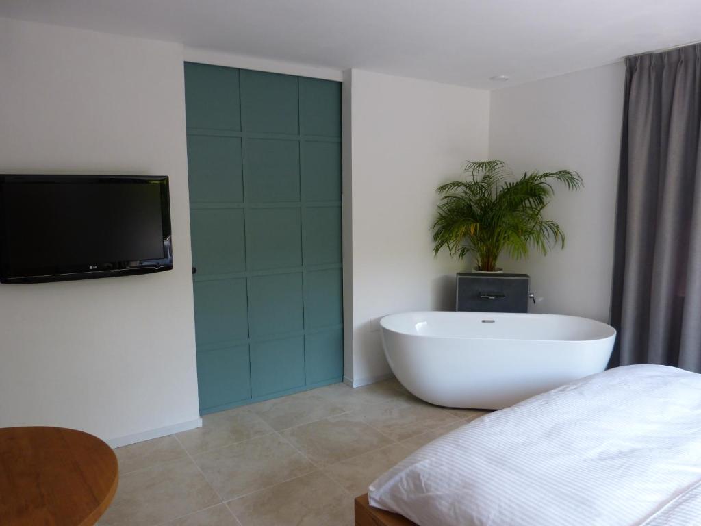 Ett badrum på Huize Triangel - Wellness studio met sauna