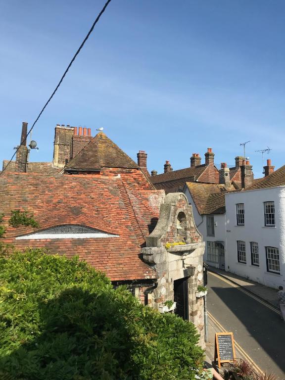 an old building in a town with a street at The Tea House in Rye
