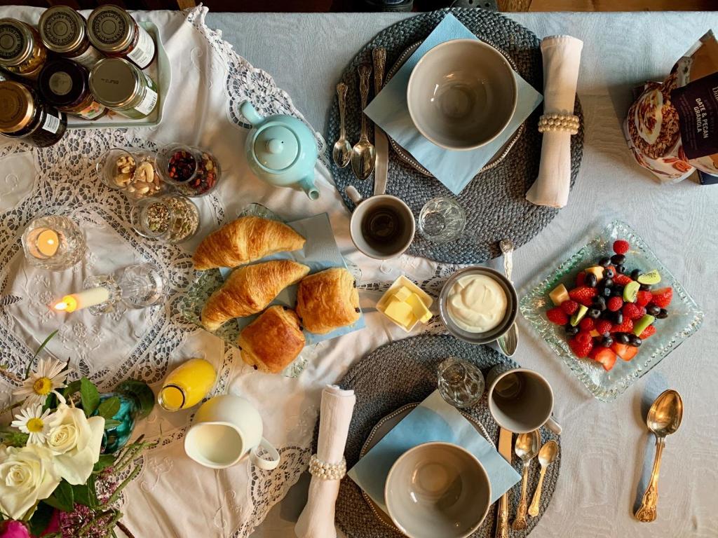 a table with breakfast foods and coffee on it at The Tea House in Rye