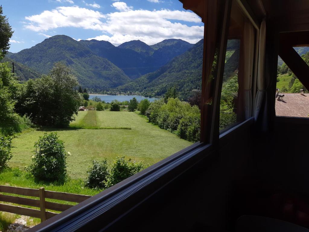a window view of a mountain view from a house at Ledro Nest in Ledro