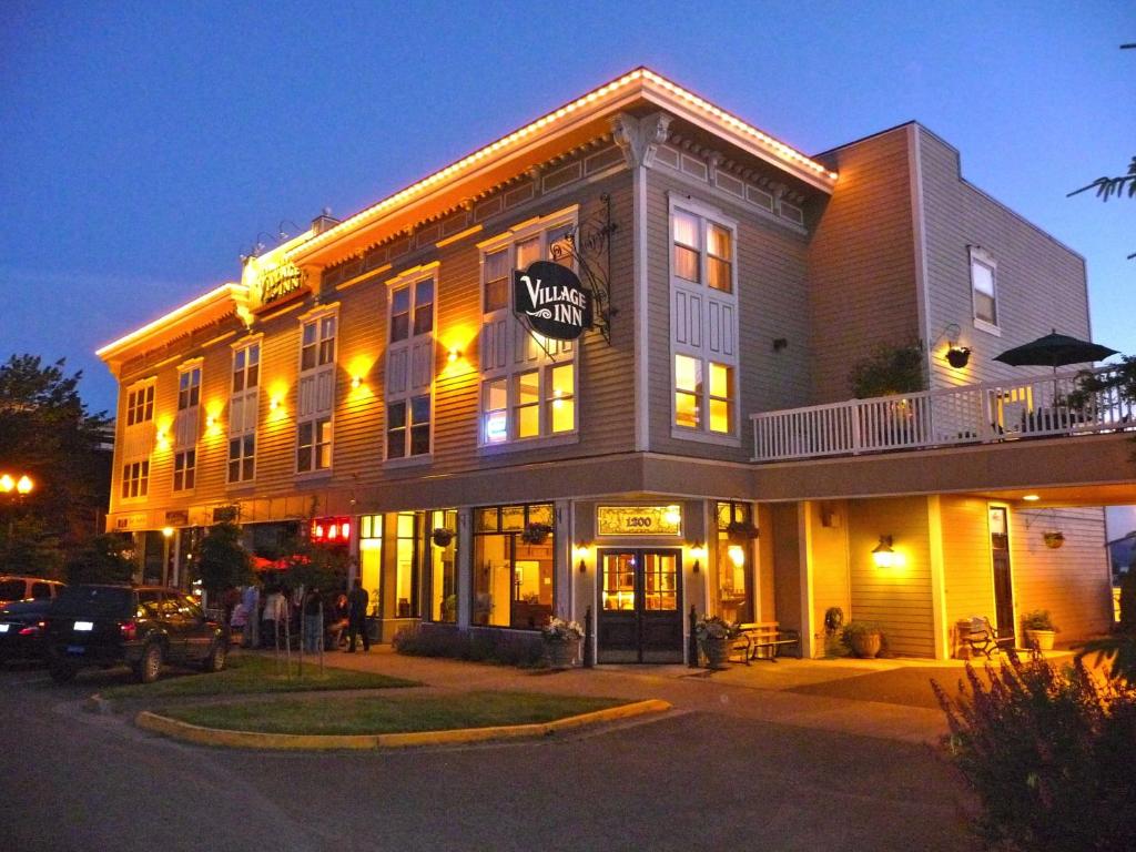 a large building with people standing outside of it at Fairhaven Village Inn in Bellingham