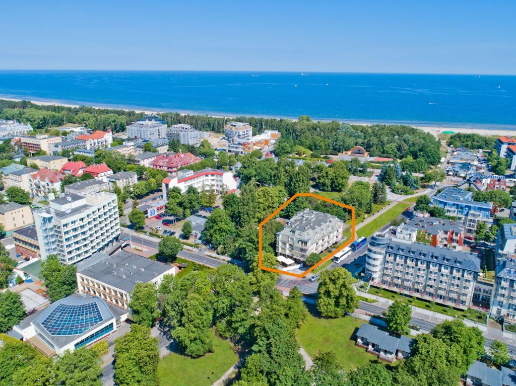 an aerial view of a city with buildings and the ocean at Villa Arstone in Świnoujście