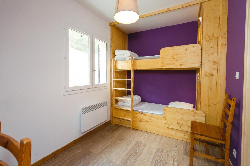 Postel nebo postele na pokoji v ubytování ETERPA Les chalets de Pré Clos en Vercors
