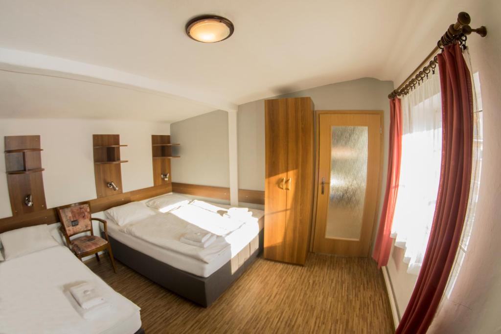 Postel nebo postele na pokoji v ubytování Studia a apartmány U Karla