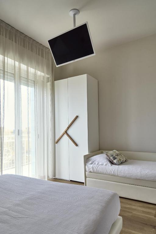 Postel nebo postele na pokoji v ubytování Hotel La Fenice