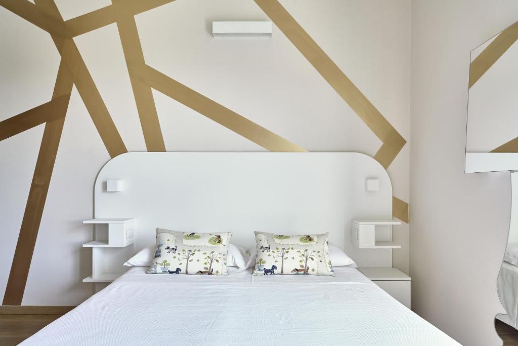 Postel nebo postele na pokoji v ubytování Hotel La Fenice