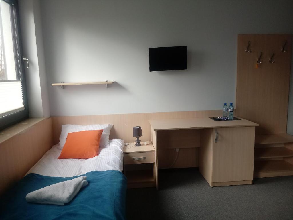 Postel nebo postele na pokoji v ubytování Hostel Załogowa