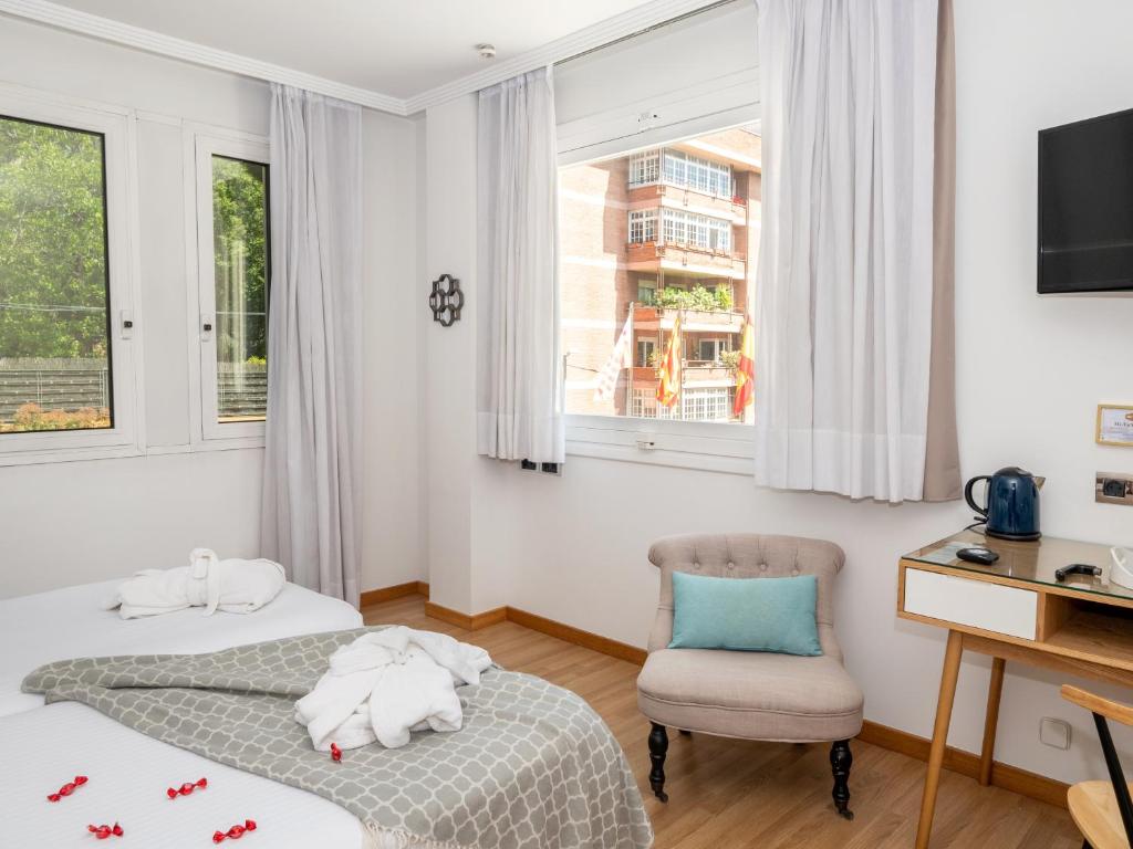 Postel nebo postele na pokoji v ubytování Vilana Hotel Boutique