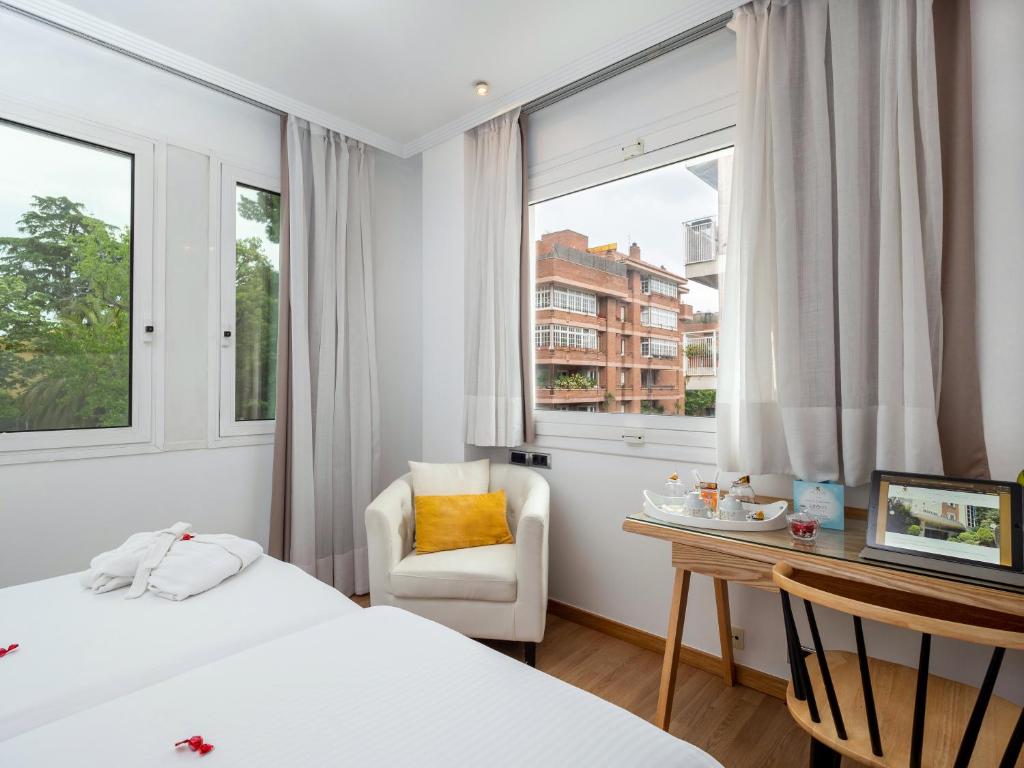 Postel nebo postele na pokoji v ubytování Vilana Hotel Boutique