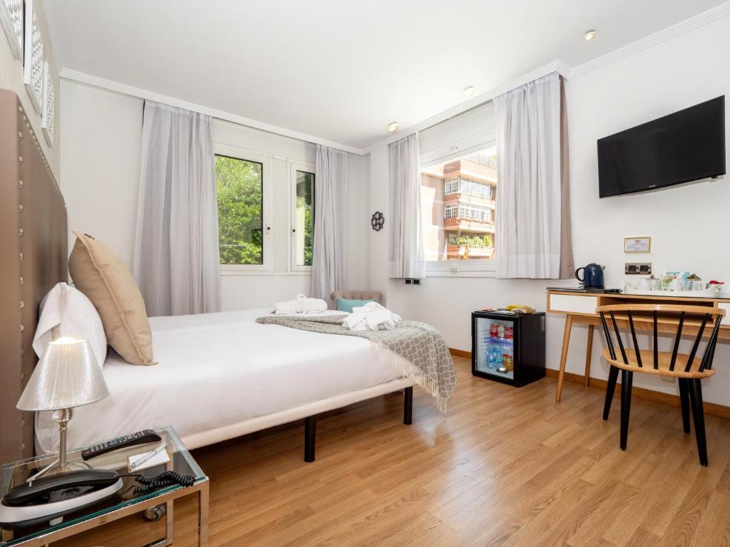 Postel nebo postele na pokoji v ubytování Vilana Hotel Boutique