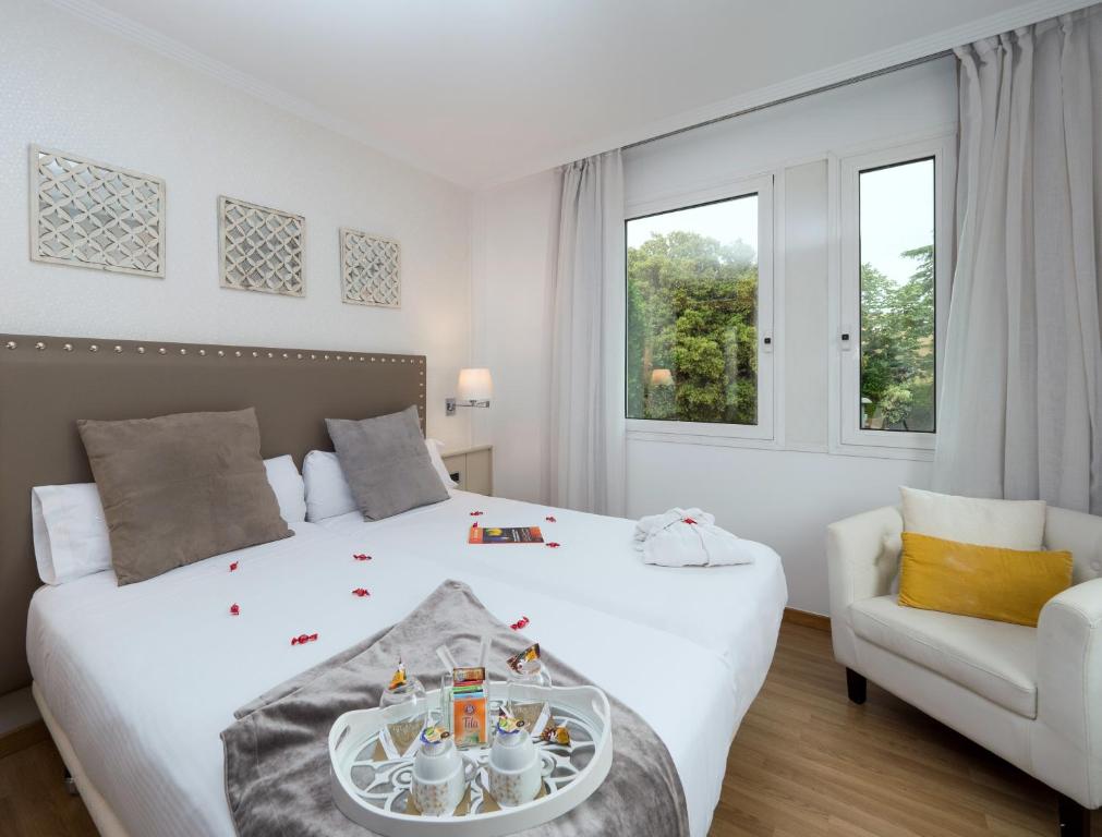 Postel nebo postele na pokoji v ubytování Vilana Hotel Boutique