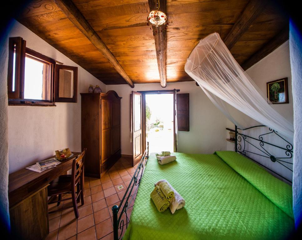 Postel nebo postele na pokoji v ubytování B&B La Torretta