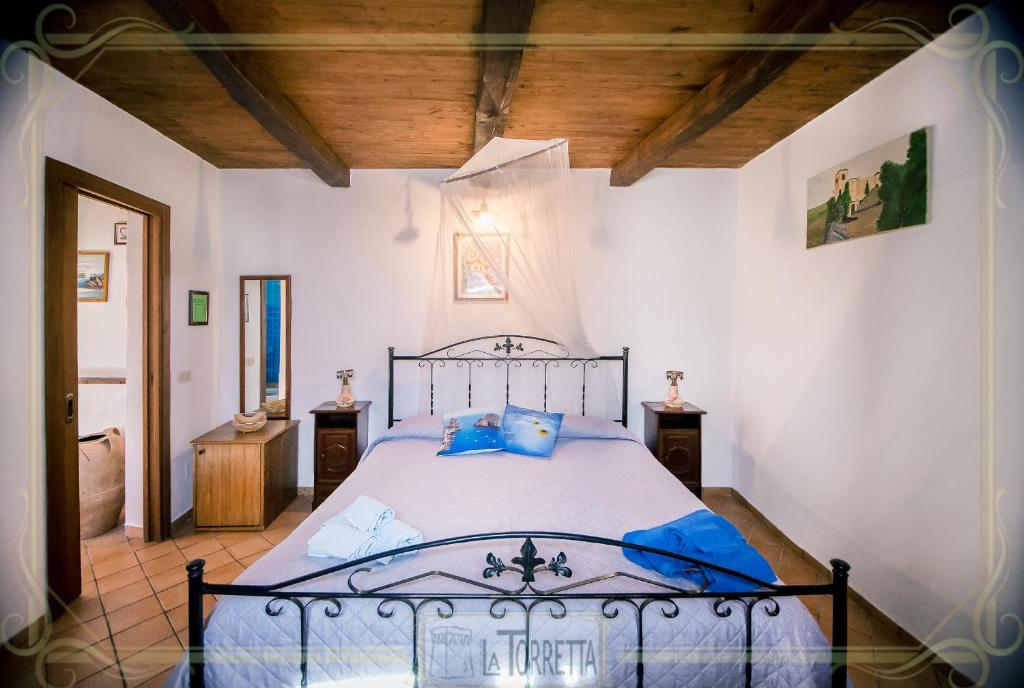 Postel nebo postele na pokoji v ubytování B&B La Torretta