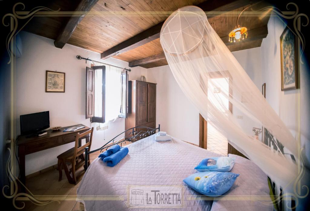Postel nebo postele na pokoji v ubytování B&B La Torretta