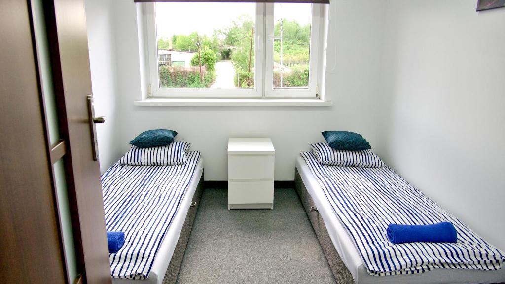 Posteľ alebo postele v izbe v ubytovaní Astra Katowice - Aparthotel