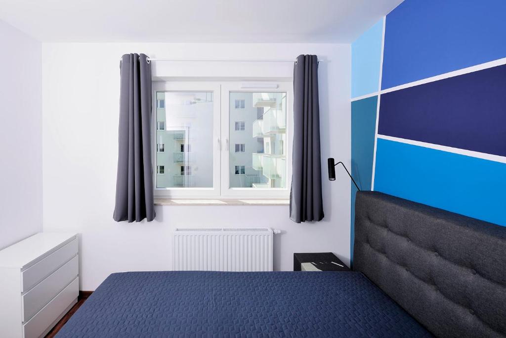 Posteľ alebo postele v izbe v ubytovaní Sleep Well Inżynierska